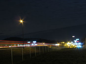 Light trails on grass at night