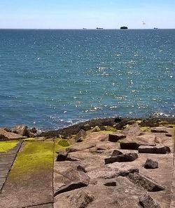 Scenic view of sea against blue sky