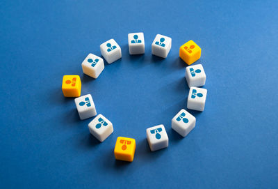 High angle view of toy blocks on blue background