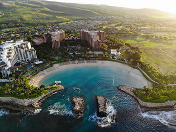 High angle view of sea and buildings in city