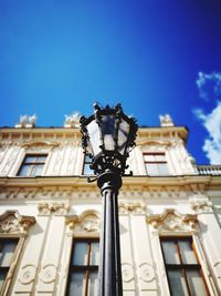 Low angle view of building against blue sky