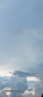 Low angle view of building against cloudy sky