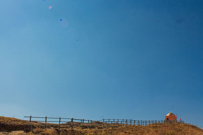 Low angle view of built structure against clear blue sky