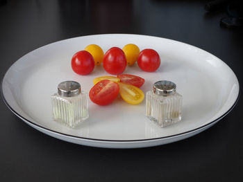 High angle view of fruits in plate on table