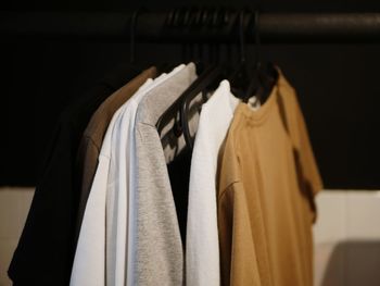 Close-up of clothes hanging in rack