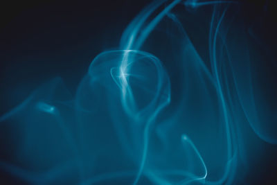 Close-up of light painting against black background