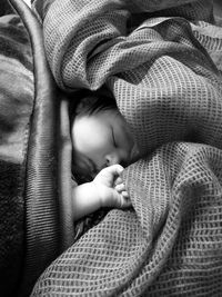 Cute baby girl sleeping in blanket