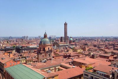 Historic buildings amidst cityscape against clear sky