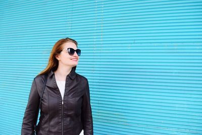 Portrait of young woman in sunglasses