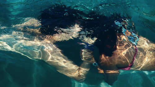 Couple kissing in swimming pool