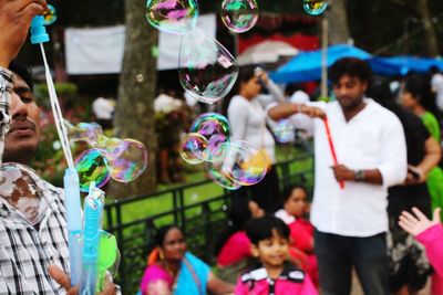 Close up of people by bubbles