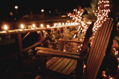 Close-up of illuminated lights on bridge at night