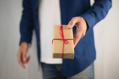 Close-up of hand holding box