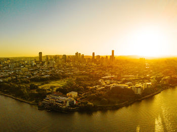 High angle view of buildings against sky during sunset