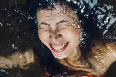 Portrait of young woman with eyes closed