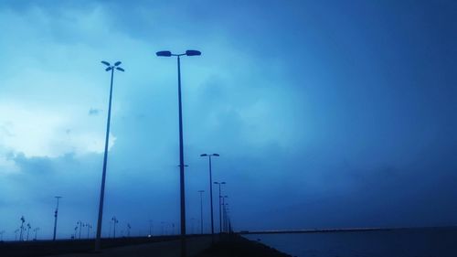 Low angle view of street light against sky