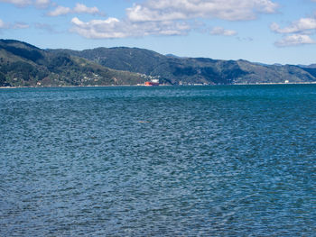 Scenic view of sea against cloudy sky