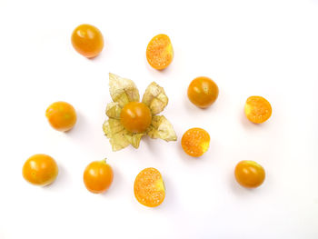 High angle view of various fruits on white background