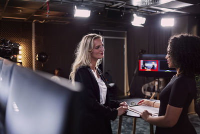 Female news anchors in studio