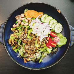 High angle view of chopped vegetables in bowl on table