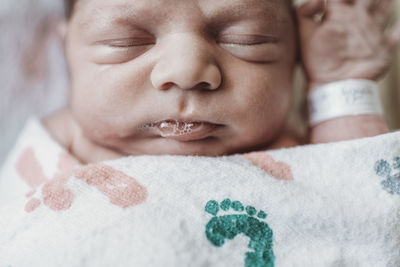 Close up detail of newborn boy face in hospital