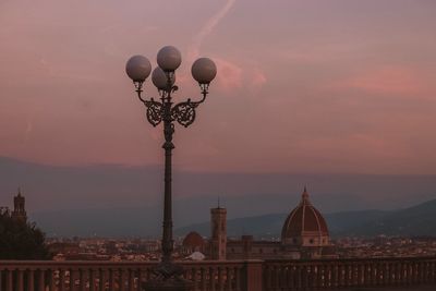 Mosque against sky during sunset