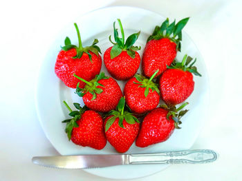 Close-up of strawberries in plate on table