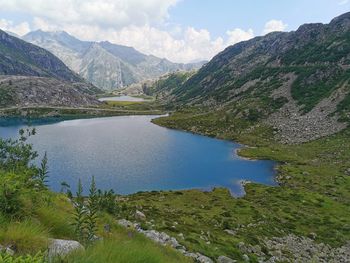 Scenic view of lake and mountains against sky