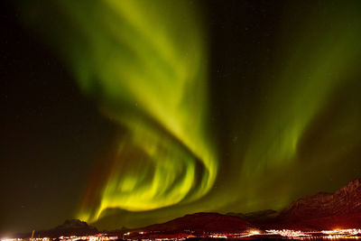 Scenic view of mountain against sky at night