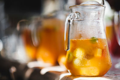 Close-up of drink in glass jar on table