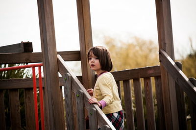 Small girl playing on the playground