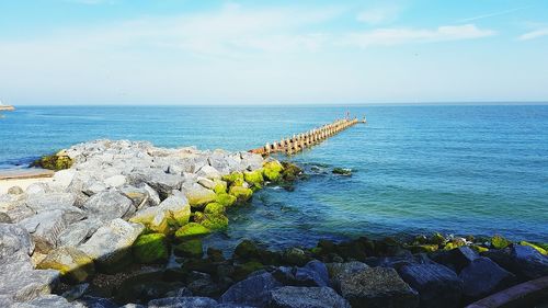 Scenic view of sea against blue sky