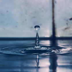 Close-up of drop splashing in water