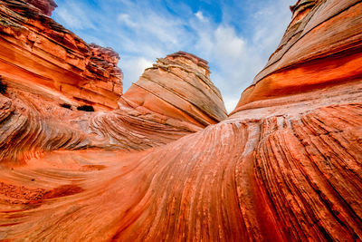 Low angle view of rock formations against sky