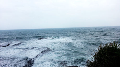 Scenic view of sea against clear sky