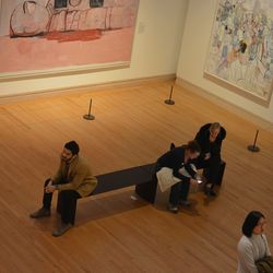 Two men sitting on floor