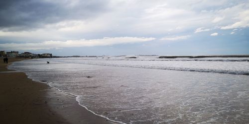 Scenic view of beach against sky