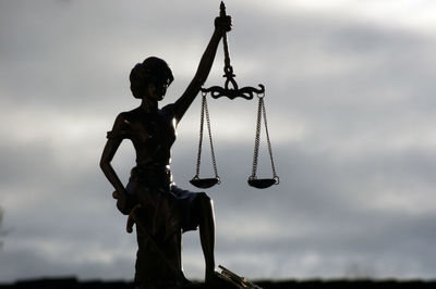 Low angle view of statue against sky