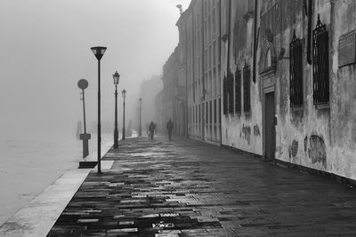 Narrow street along buildings