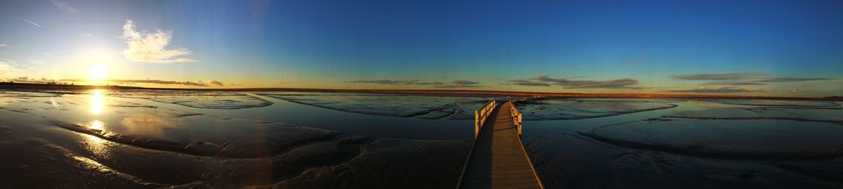 Panoramic view of sea against sky during sunset