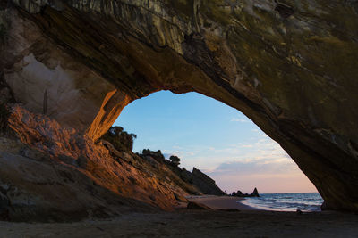 Scenic view of sea seen through cave