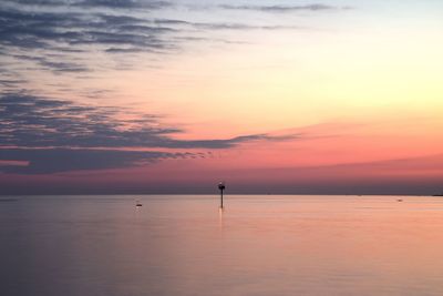 Scenic view of sea against sky at sunset