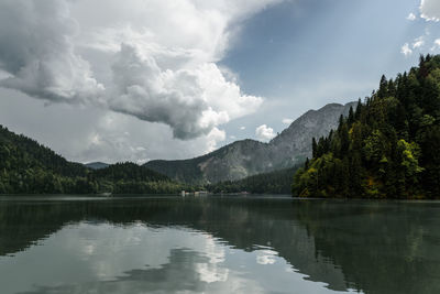 Scenic view of lake and mountains against sky