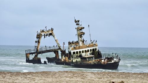 Boat in sea against clear sky