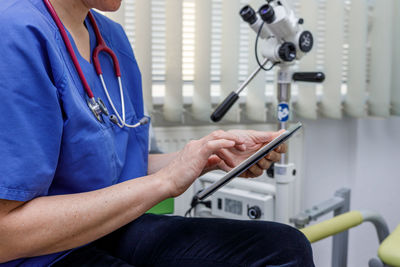 Doctor writing on the tablet the diagnosis during the consultation in the gynecological office