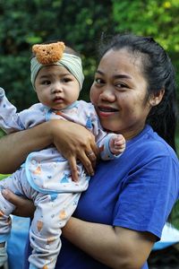 Portrait of smiling mother and daughter
