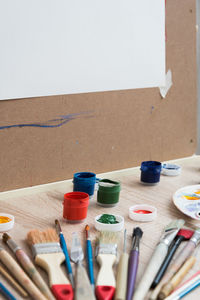 Close-up of paintbrushes on table