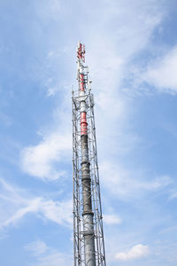 Low angle view of communications tower against sky