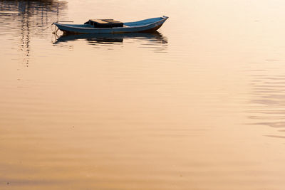 Boat moored in lake