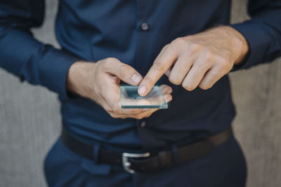 Businessman using futuristic portable device